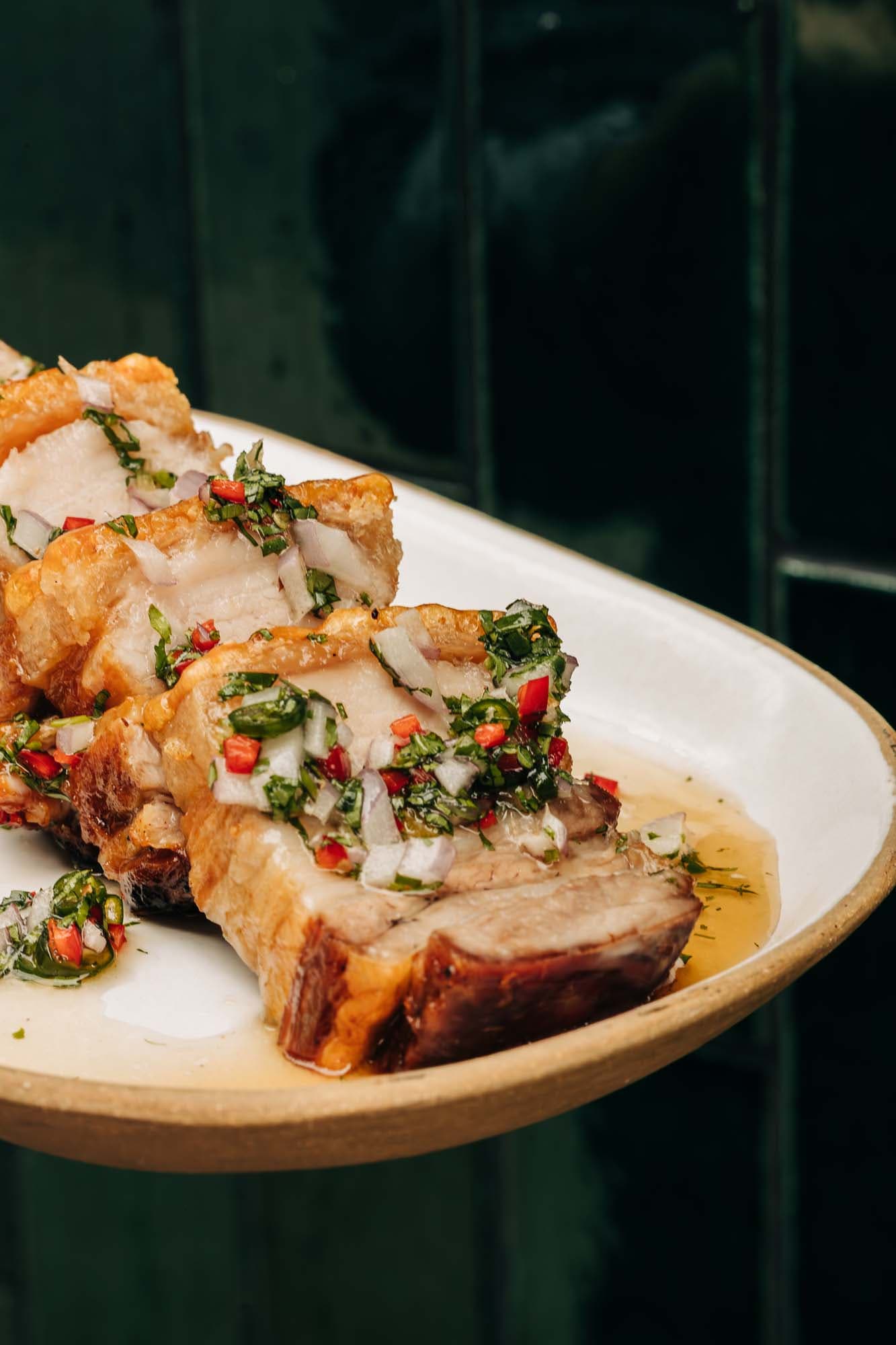 slices of pork belly with chili garlic relish